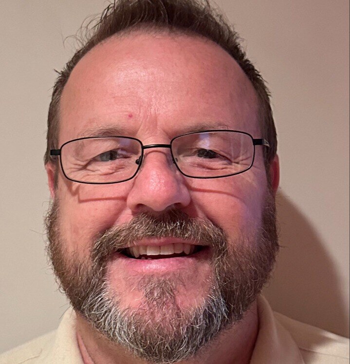 Headshot of Harold wearing glasses, a member of the R Value Homes team in West Michigan