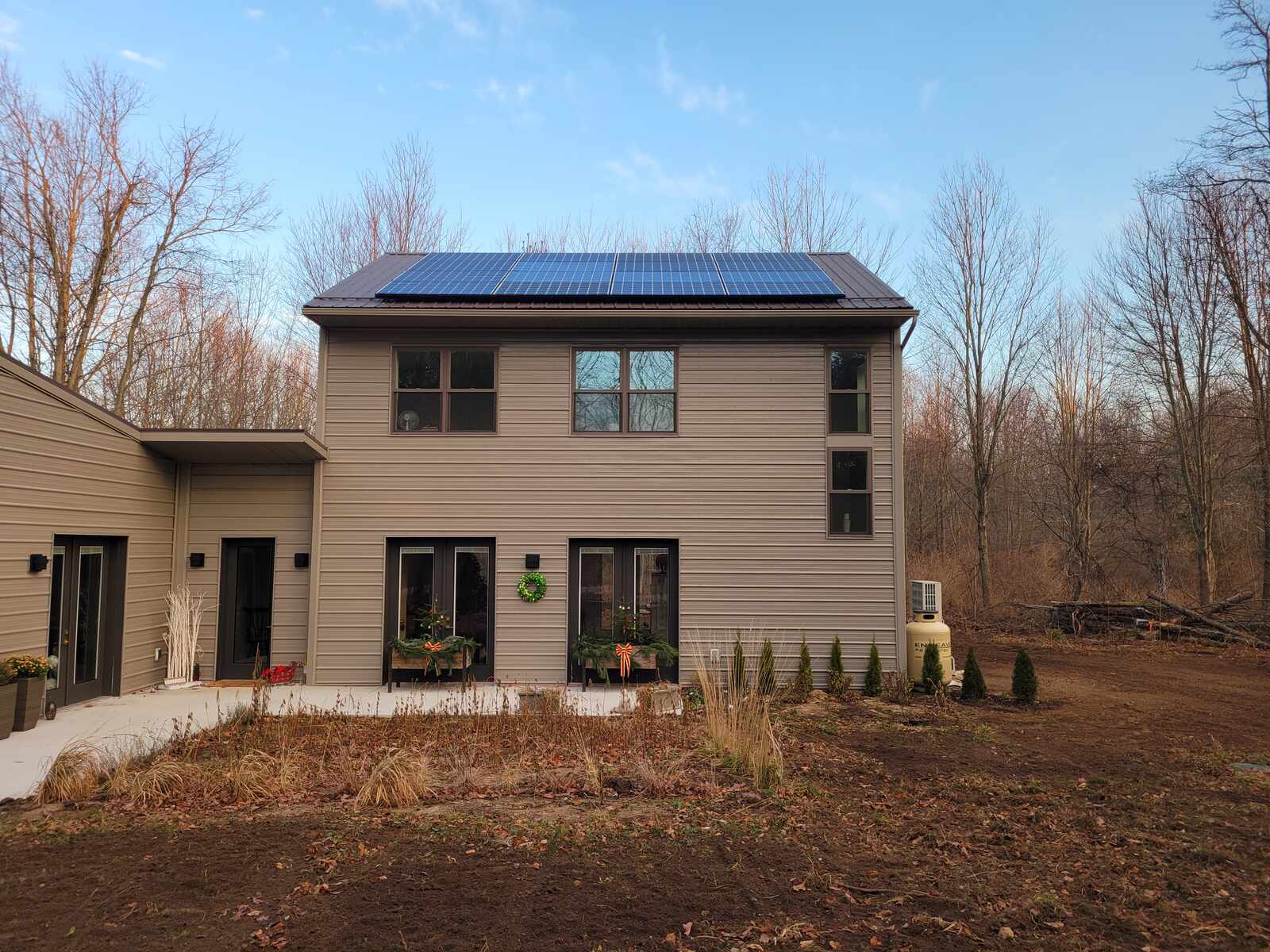 Rear exterior of a solar-powered home in West Michigan, completed by R Value Homes