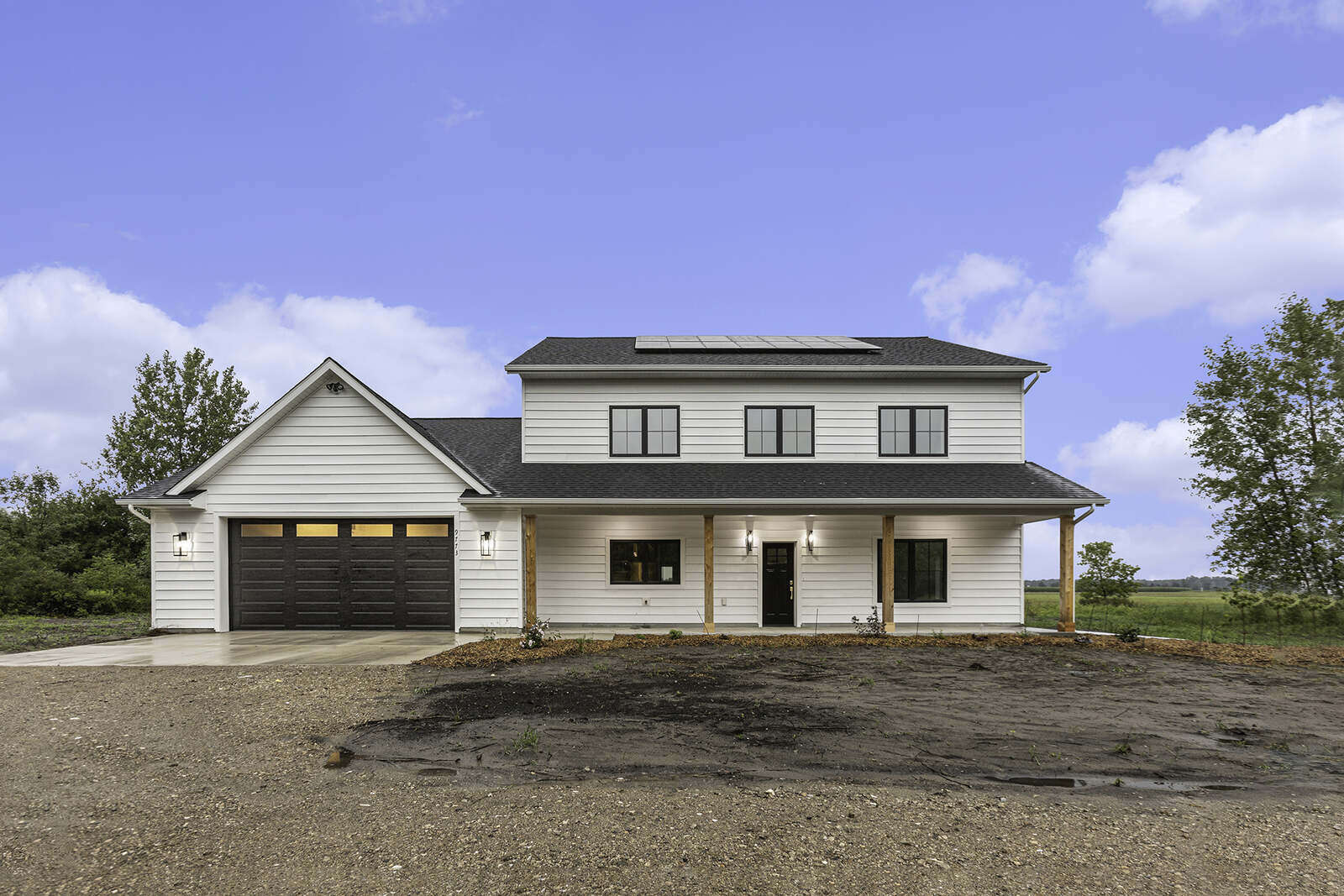 Front view of a solar-panel equipped home by R-Value Homes in West Michigan